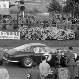 RK 702 - Stirling Moss - Ferrari 250 crossing the line
